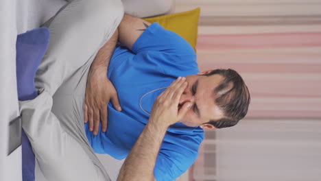 Vertical-video-of-Man-with-nausea.